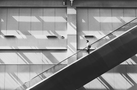 Man walking down a staircase.