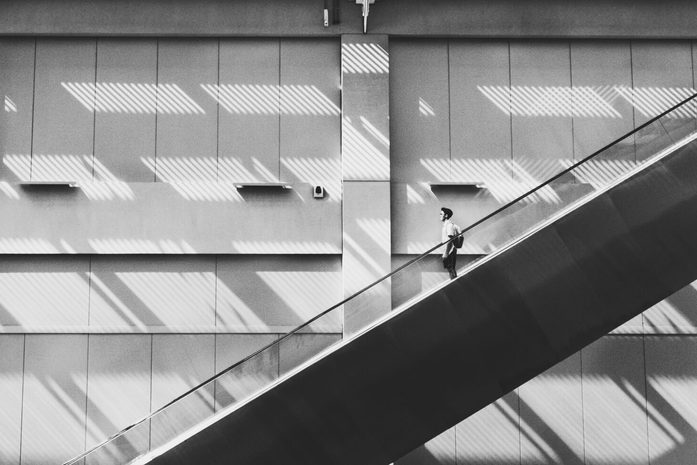 Man walking down a staircase.