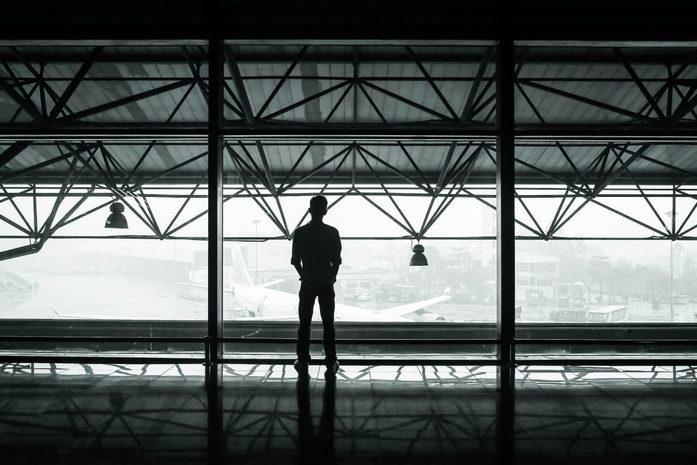 Silhouette of a man waiting for subway